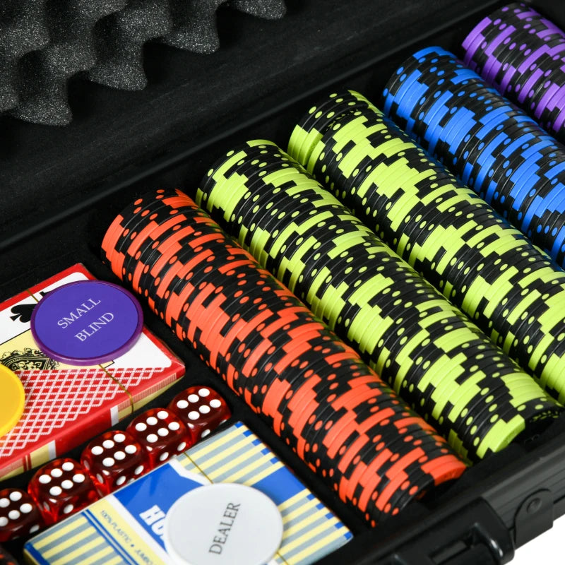 Poker chips in various colors with cards and dice in a case