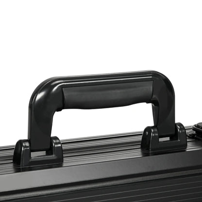 Close-up of a black suitcase handle on a white background