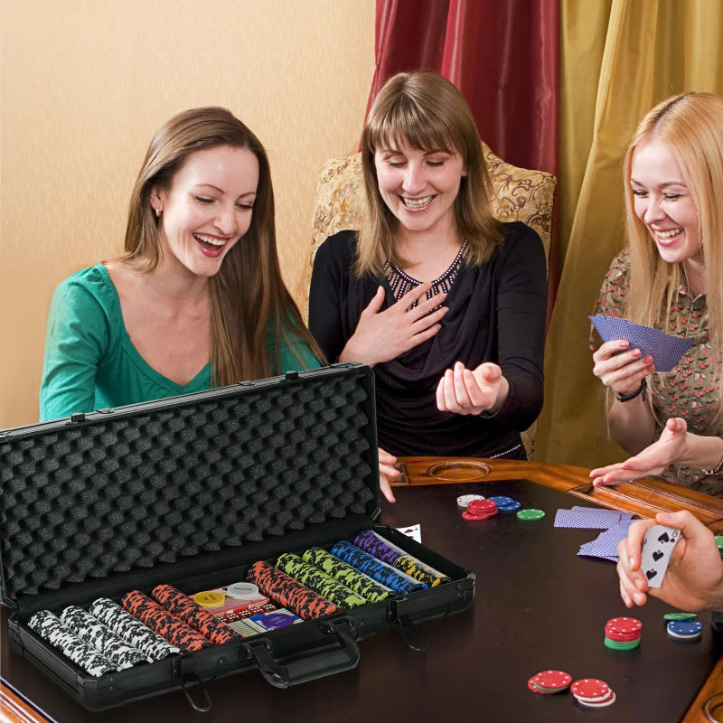 Three women playing poker with a set of poker chips and cards on a table.