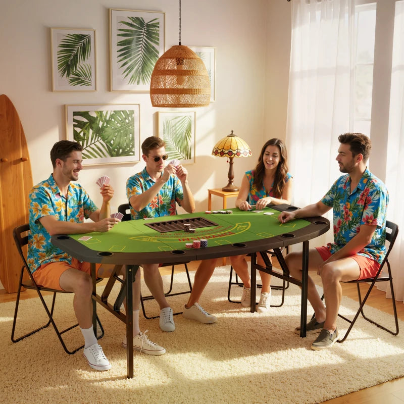 Four people playing cards around a green folding table in a bright room with decor elements.